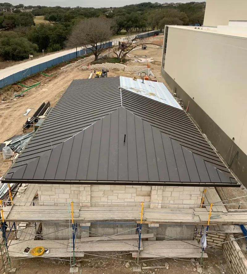 Metal roof new construction with scaffolding in Camp Springs