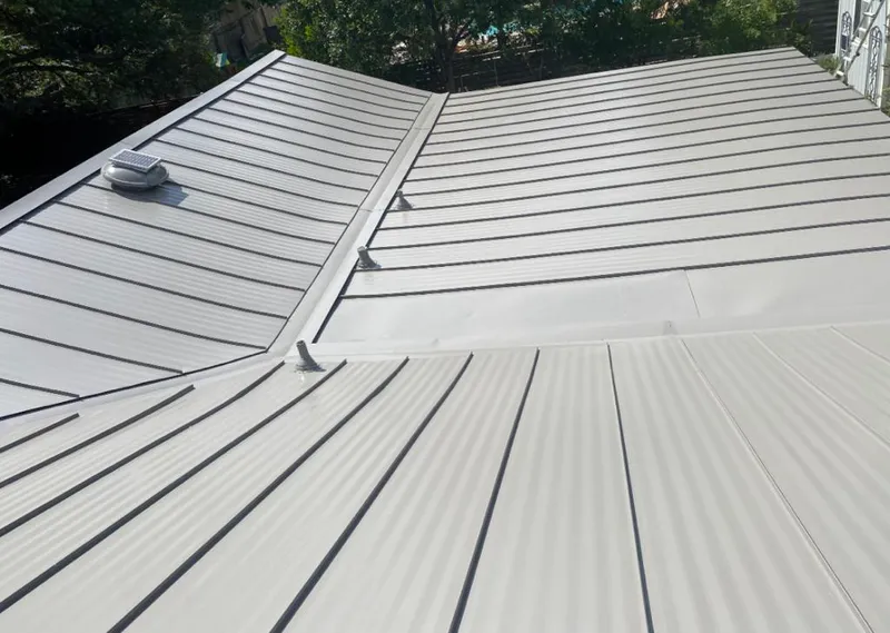 Solar attic fan installed on a metal roof for Roof Ventilation in Camp Springs